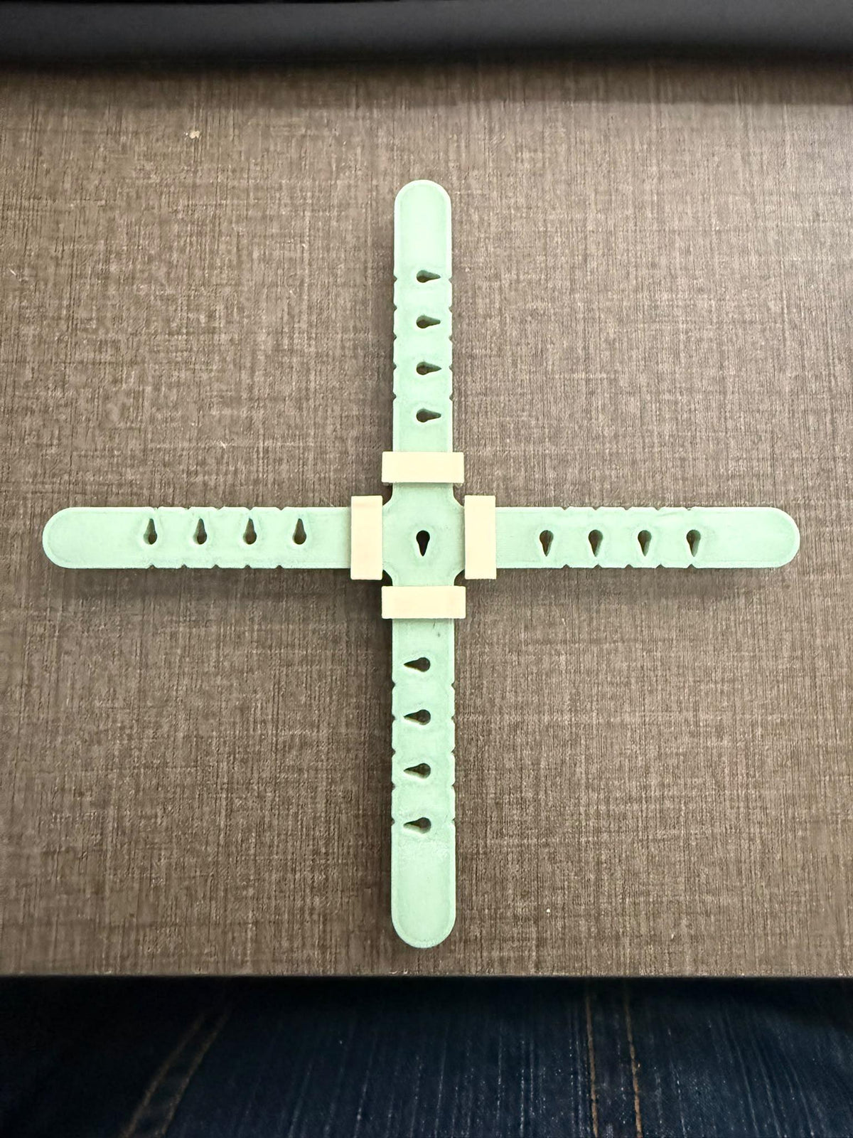 Adjustable wick centering device on candle jar
