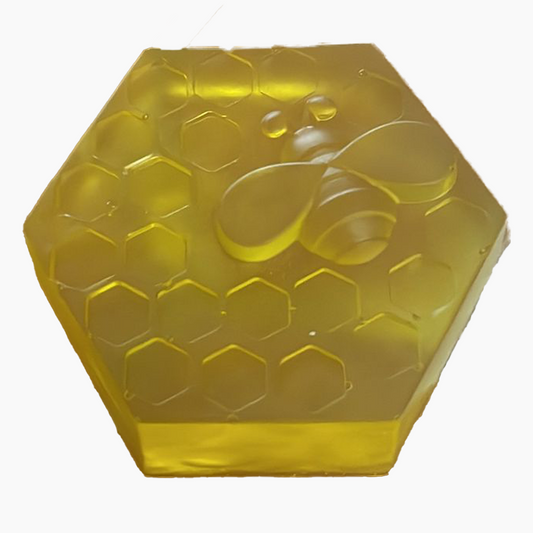 Handmade transparent glycerin soap in the shape of a beehive made with natural ingredients